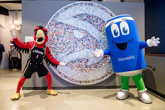 Hawks and Novelis mascots posing for a picture.